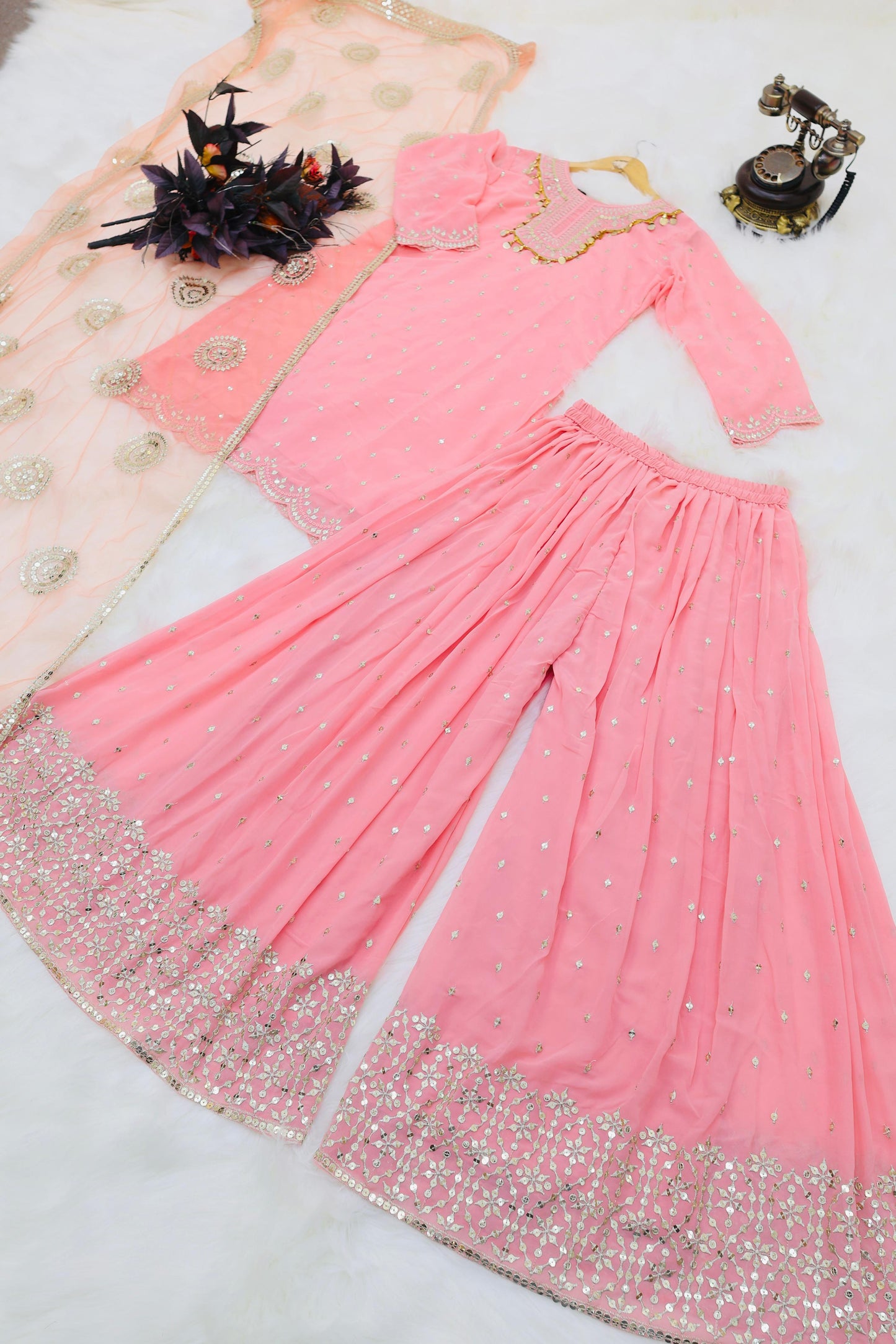 Glorious Peach Color Sharara Suit With Net Dupatta