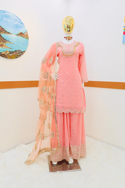 Glorious Peach Color Sharara Suit With Net Dupatta