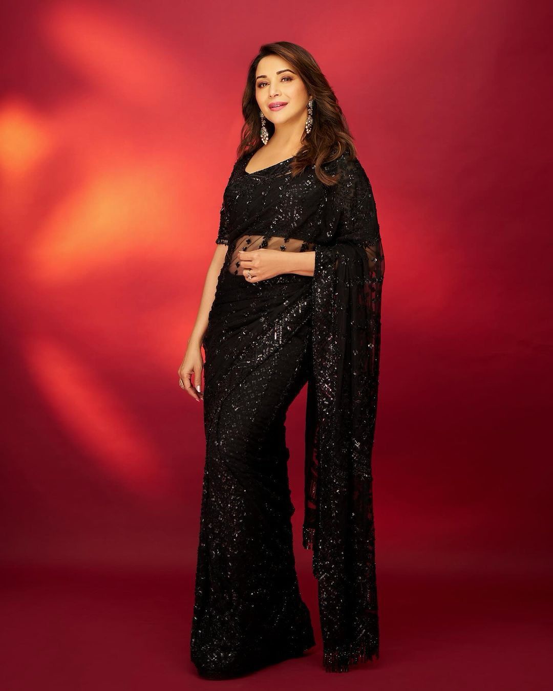 Pin by ghar shrishti on Sarees | Black saree, Madhuri dixit, Bollywood dance