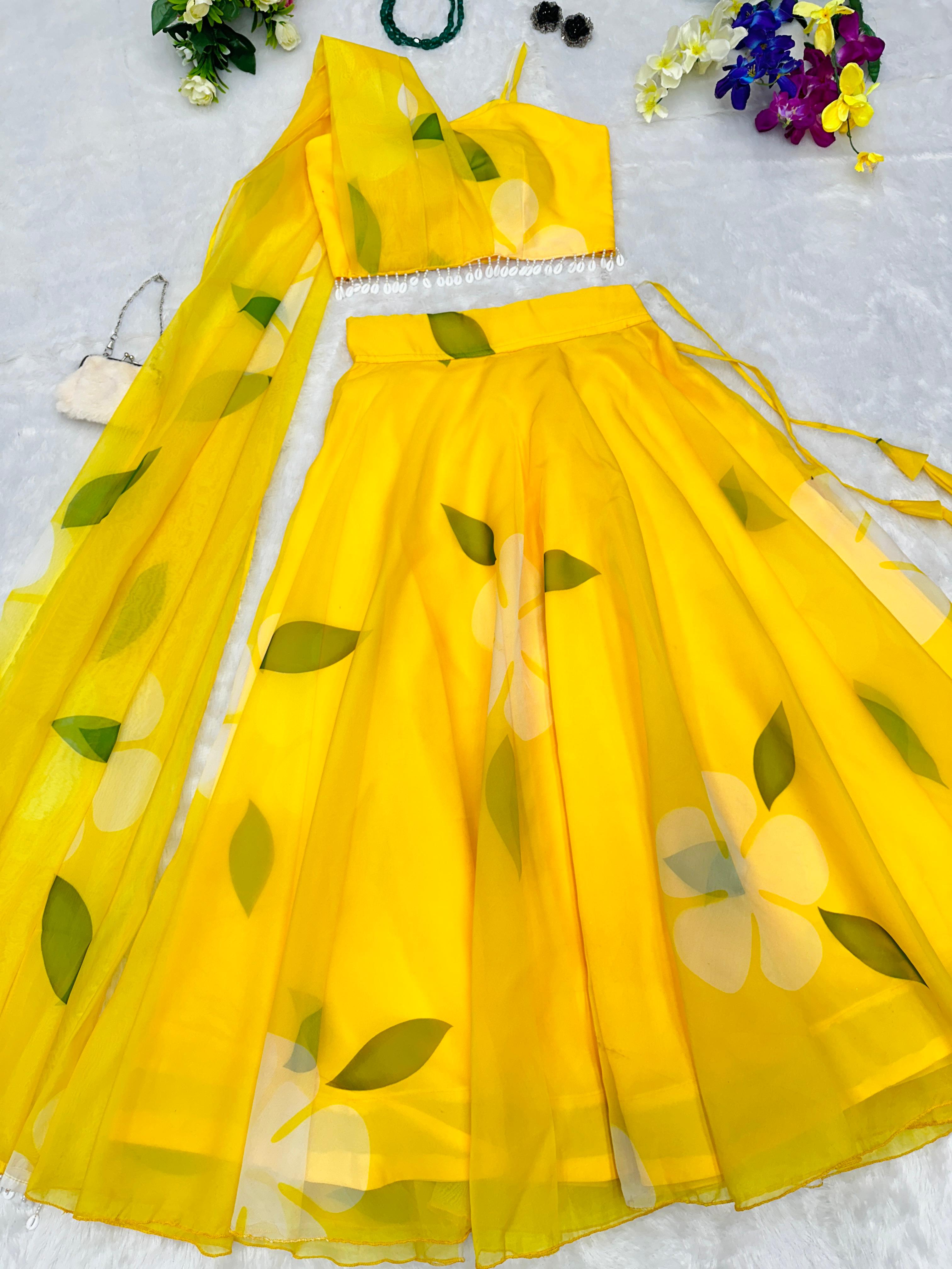 Organza Yellow Color Lehenga And Blouse With Attached Dupatta