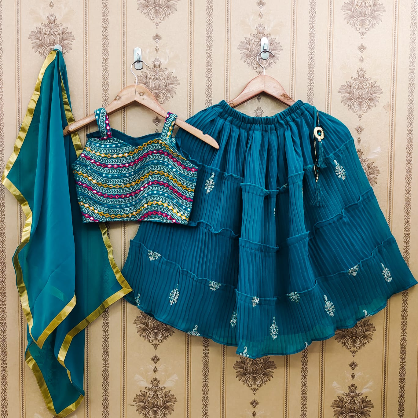 Lovely Kids Teal Blue Color Plated Lehenga Choli