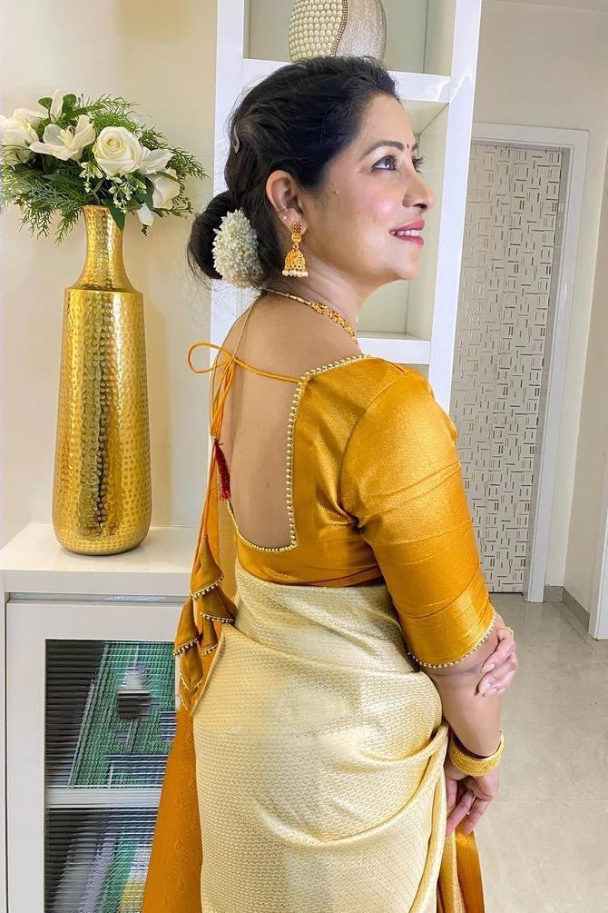 Wonderful Yellow And White Color Golden Jari Saree